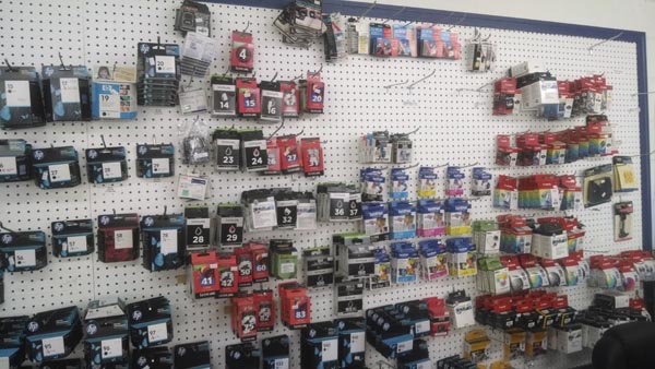 Printer ink cartridges hanging on a wall